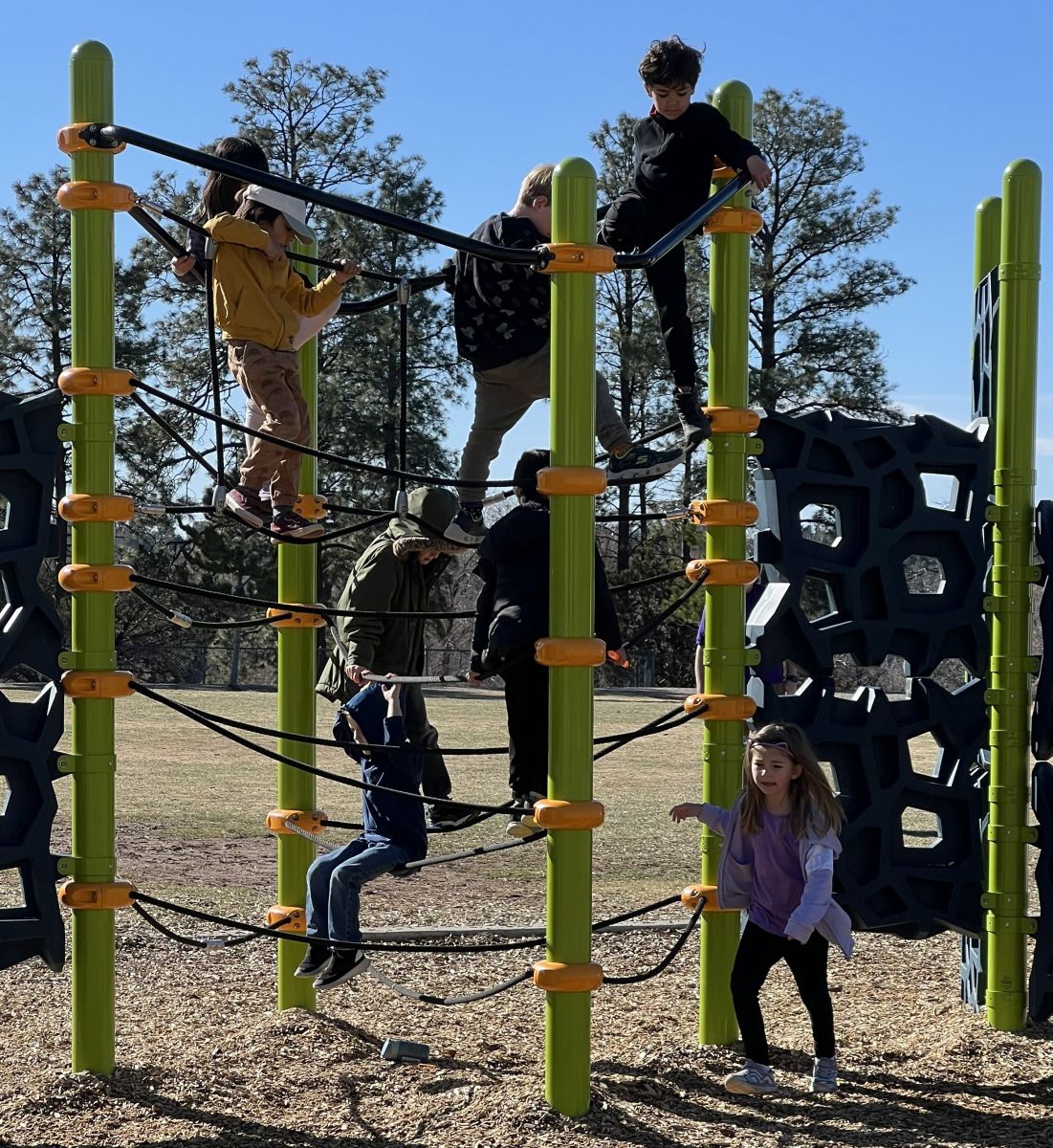 Parent and children arriving for summer camp or afterschool care