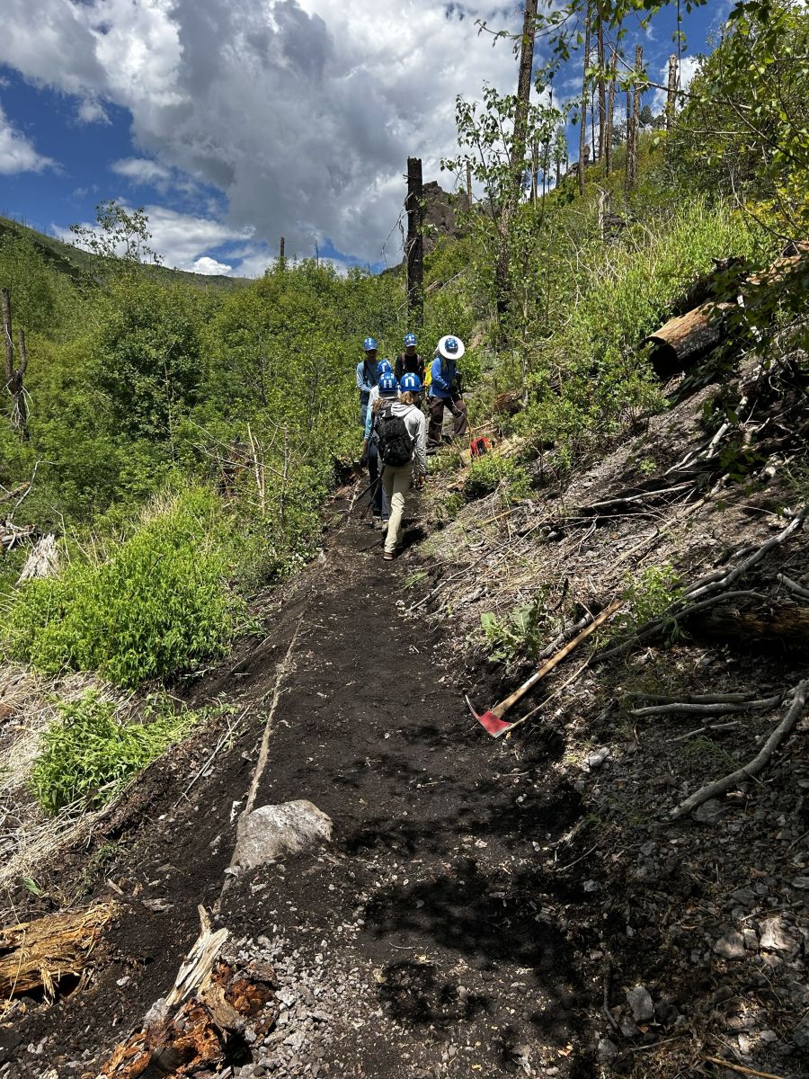 Crew repairing a trail along a ridgeline